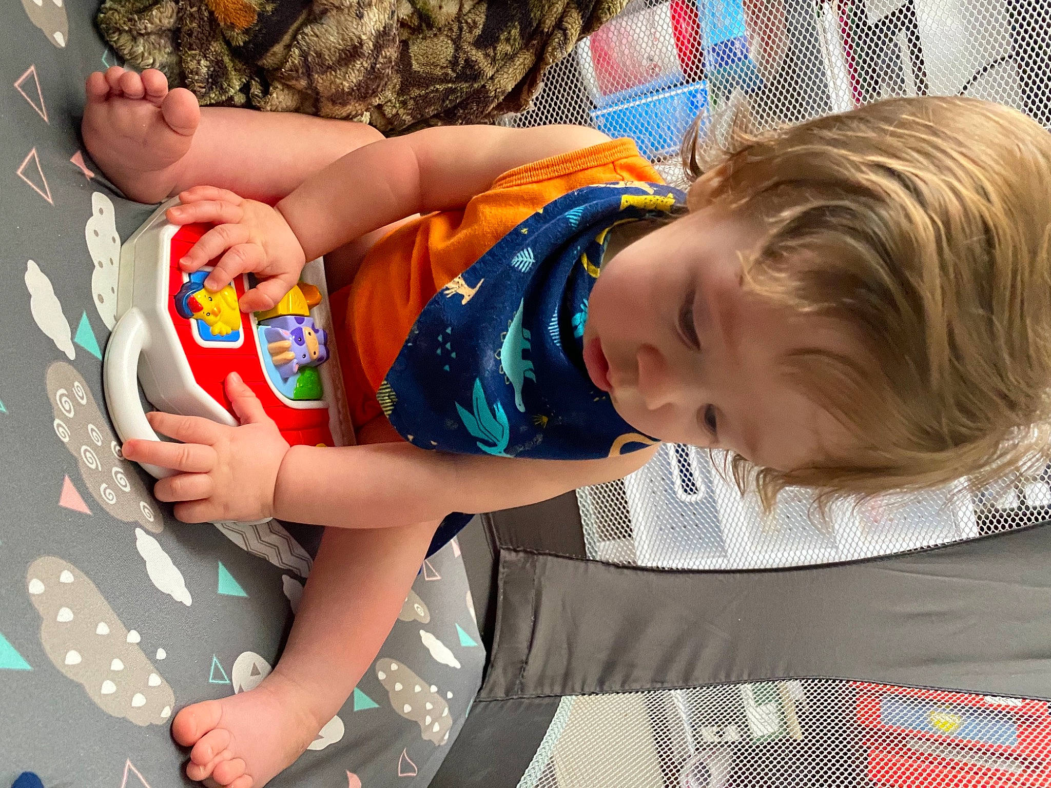 Taylor is registered to the contest to win money with this photo: baby, baby_toddler_clothing, child, comfort, elbow, fun, happy, human_leg, leisure, pattern, person, play, product, room, sitting, sunglasses, t_shirt, thigh, toddler, tree