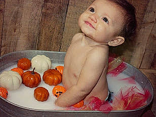 Adrianna is registered to the contest to win money with this photo: baby, bathing, bathtub, cheek, child, food, orange, person, toddler