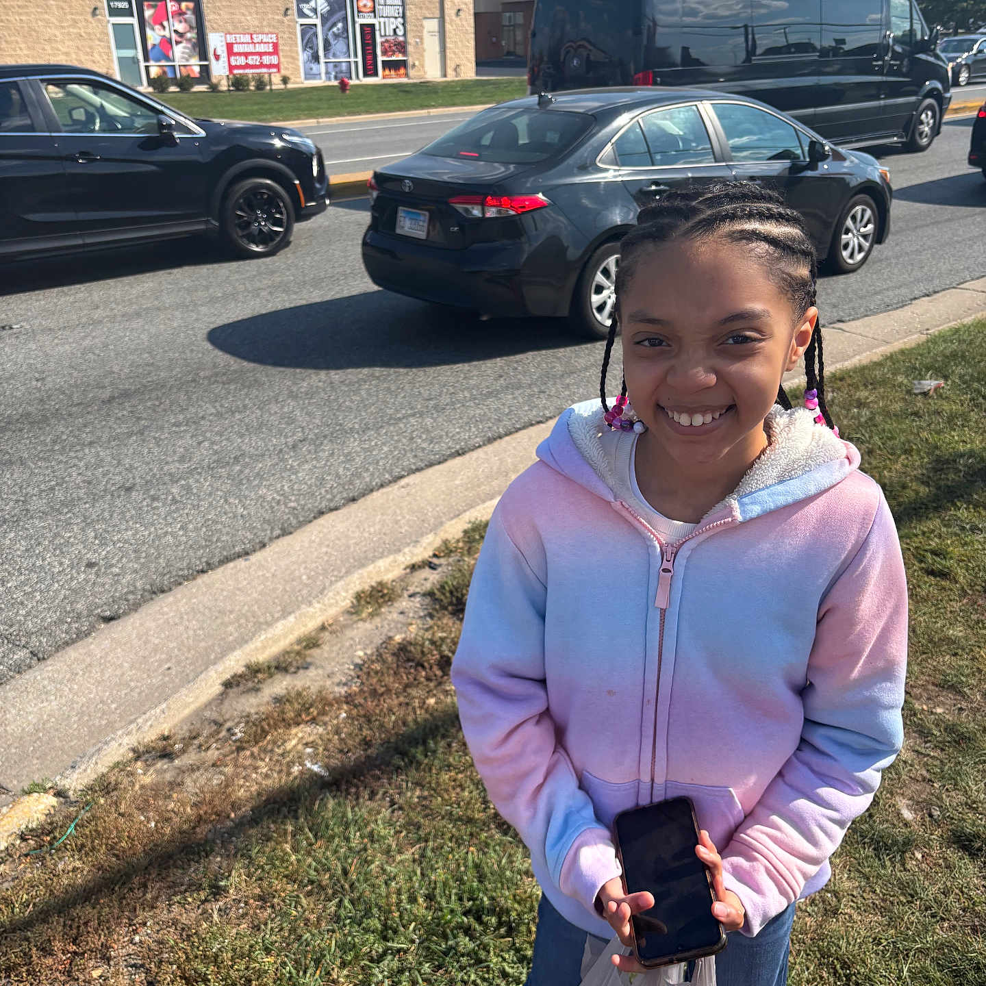 Princess joined the competition — help win amazing prizes! beads, braids, cars, child, daylight, gamestop, girl, grass, happy, hoodie, outdoor, person, phone, road, shopping_bag, sidewalk, smiling, storefront, street, urban