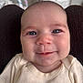 baby, infant, face, smile, blue_eyes, clothing, cream_outfit, closeup, cute, child, person, portrait, indoors, soft_light, texture, head, happy, skin, baby_garment, background