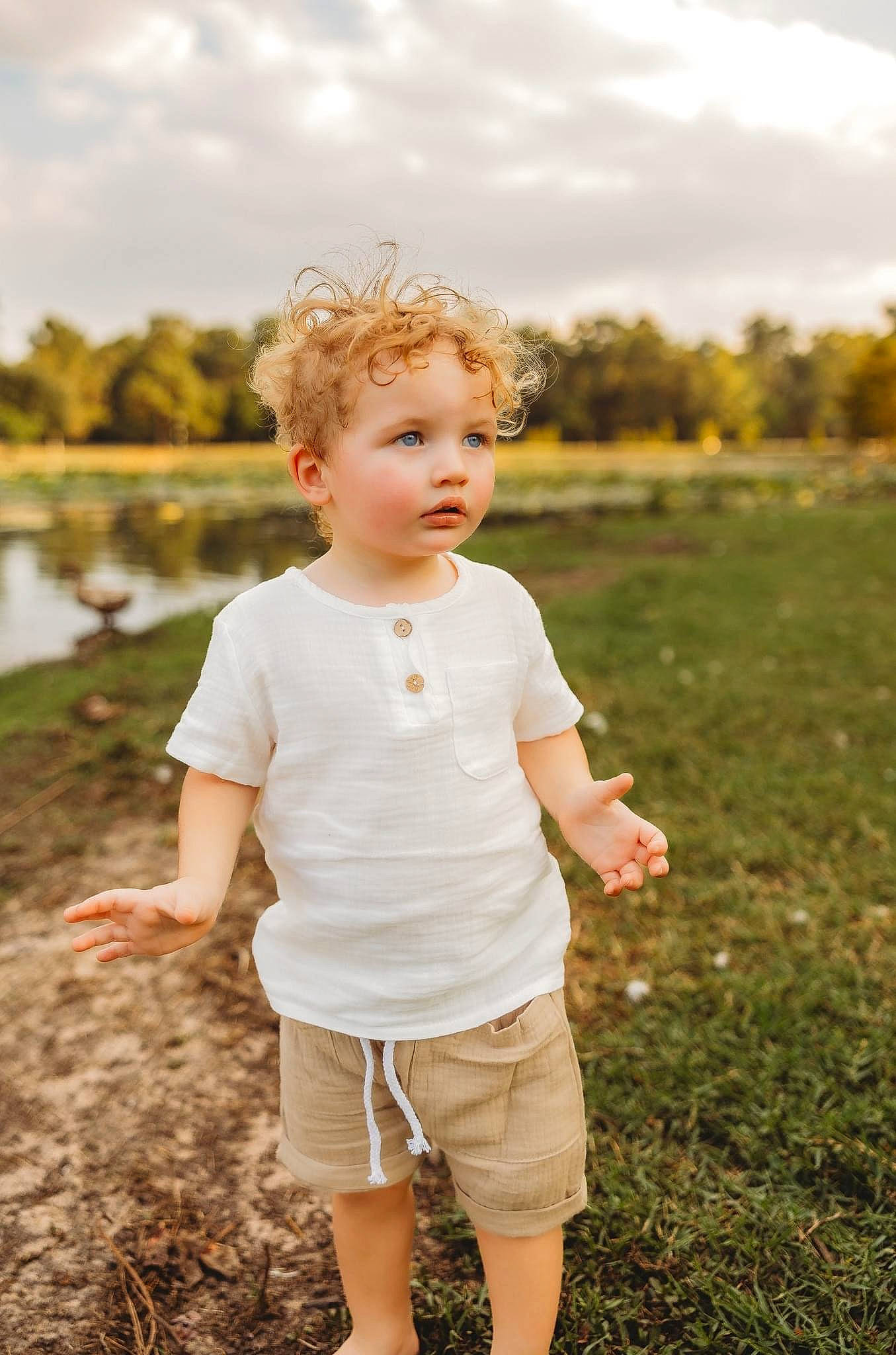 Kolt is registered to the contest to win money with this photo: ball, cloud, flash_photography, fun, gesture, grass, grassland, hairstyle, happy, people_in_nature, person, plant, shorts, sky, sleeve, standing, summer, sunlight, t_shirt, toddler