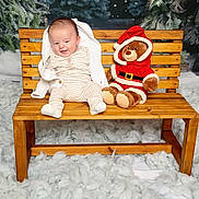 Jacob joined the competition — help win amazing prizes! baby, bench, child, clothing, cozy, cute, festive, happy, holiday, indoor, pajamas, plush_toy, portrait, seat, smile, snow_effect, soft_texture, teddy_bear, winter_theme, wood