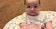 Luna joined the competition — help win amazing prizes! architecture, baby, building, clothing, couch, cushion, face, furniture, happy, head, homedecor, indoors, livingroom, person, photography, portrait, room, sitting, t_shirt, tape
