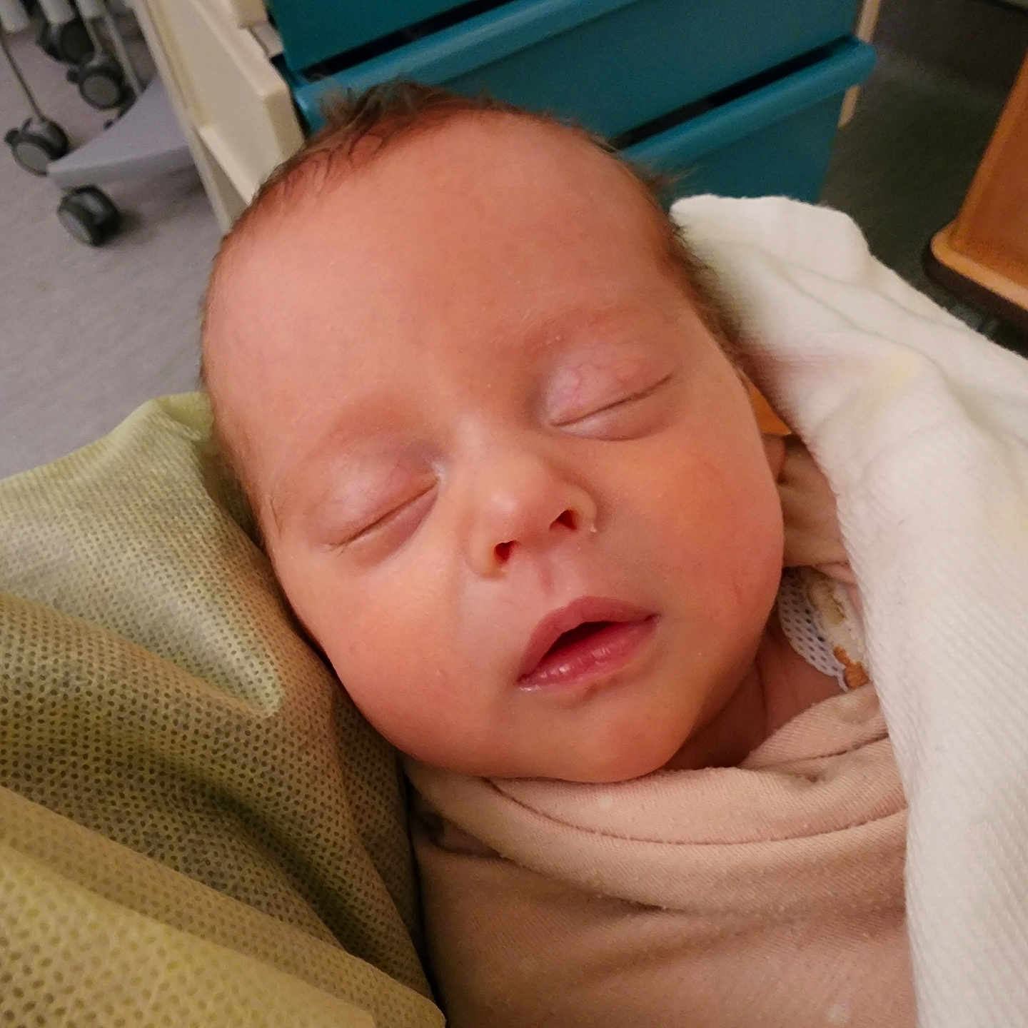 Ella joined the competition — help win amazing prizes! newborn, baby, sleeping, blanket, swaddled, face, infant, hospital, bed, soft, resting, closeup, person, head, peaceful, indoors, skin, comfort, healthcare, quiet