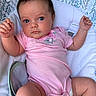 Paisley joined the competition — help win amazing prizes! baby, infant, onesie, pink_clothing, cushion, seat, indoor, person, child, face, hand, legs, cute, expression, skin, hair, eyes, newborn, comfortable, relaxing
