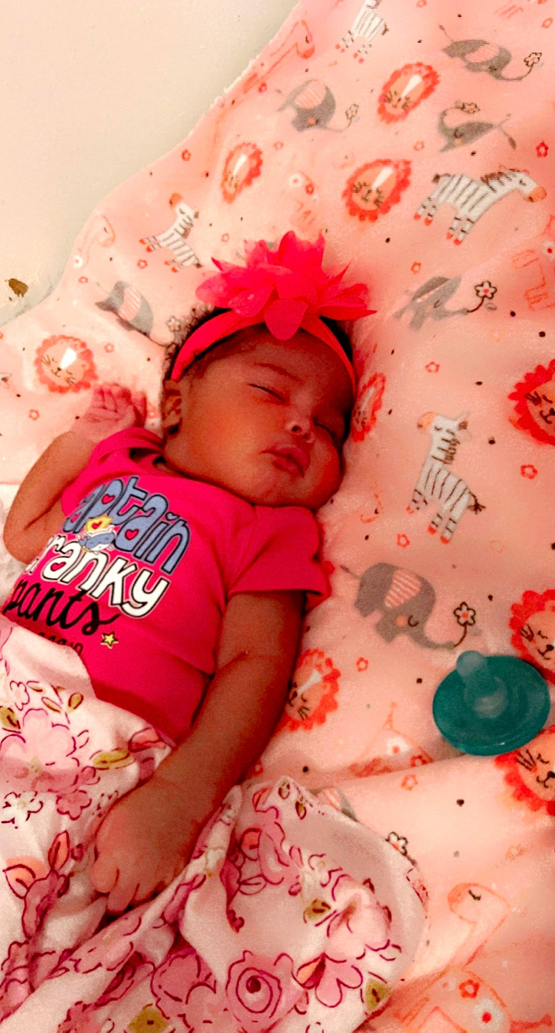 Harmonii is registered to the contest to win money with this photo: arm, baby, baby_sleeping, baby_toddler_clothing, cheek, comfort, finger, happy, headwear, human, mammal, muscle, orange, person, pink, product, red, skin, sleeve, textile