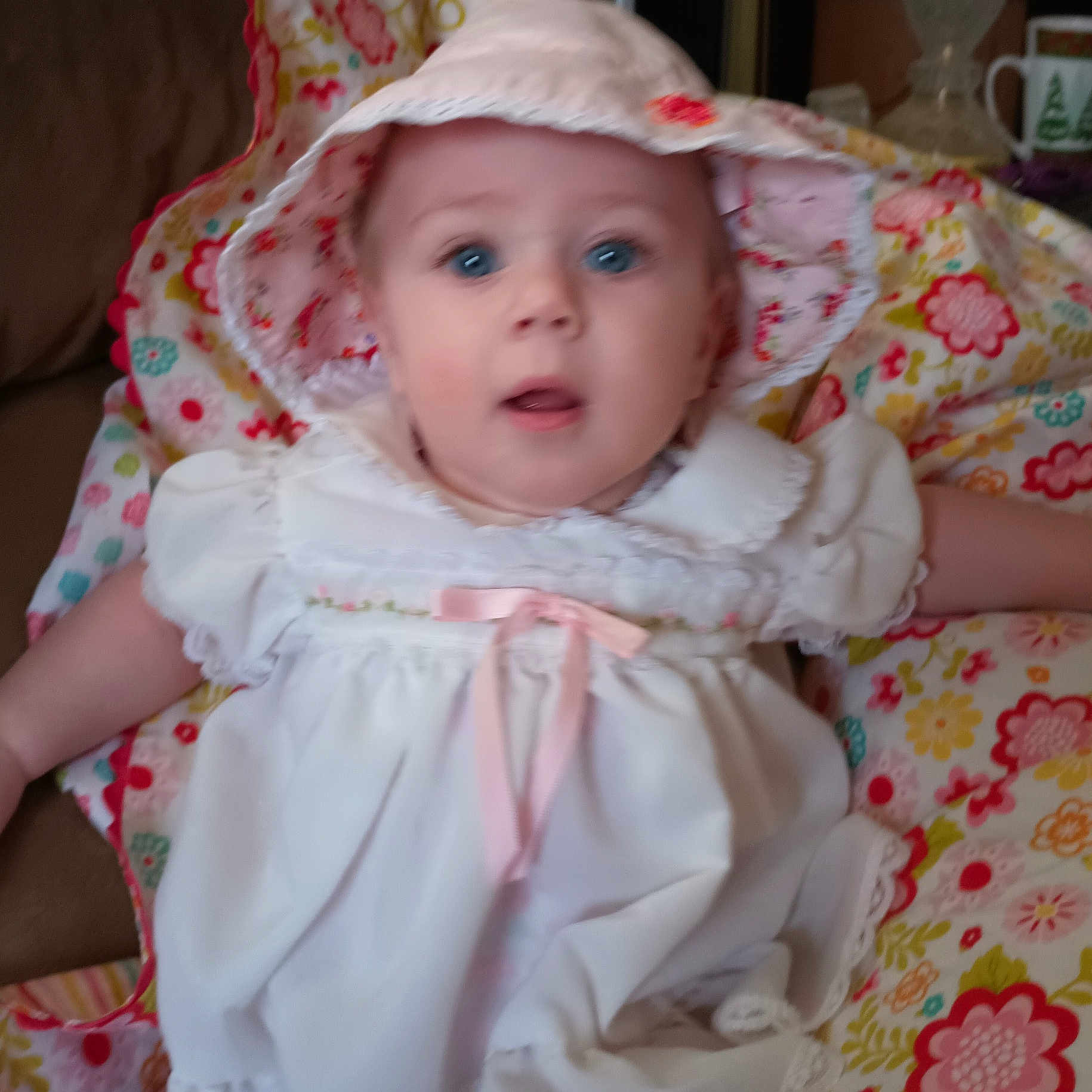 Sadie joined the competition — help win amazing prizes! baby, bonnet, clothing, cup, dress, face, hat, head, hood, person, photography, portrait, sunhat
