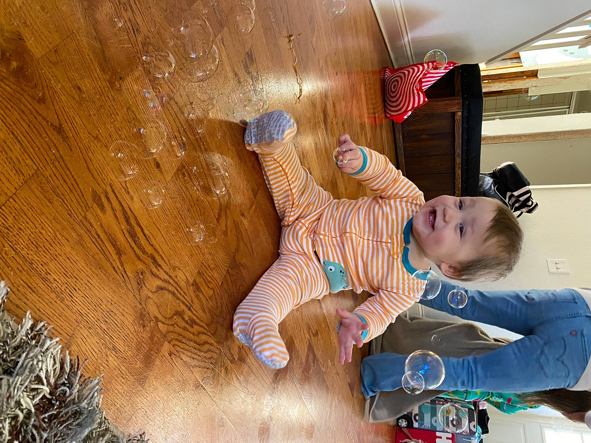 Rayden is registered to the contest to win money with this photo: baby, baby_products, baby_toddler_clothing, ceiling, child, flooring, fun, happy, hardwood, leisure, pattern, person, play, room, sitting, smile, textile, toddler, tree, vacation