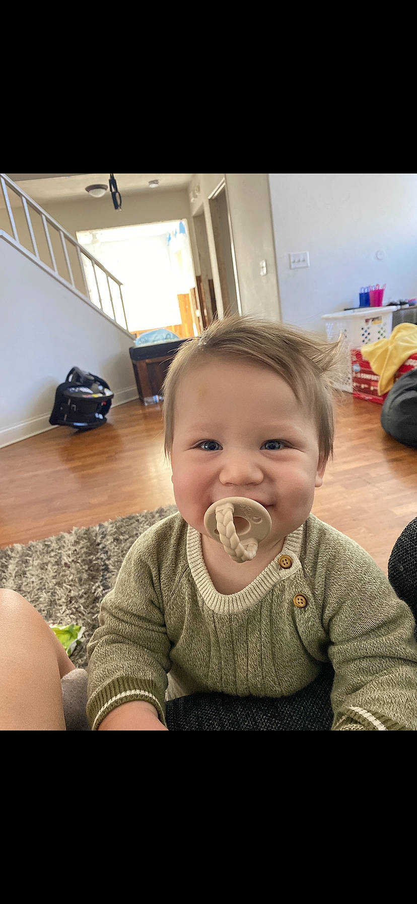 Rayden is registered to the contest to win money with this photo: arm, baby, baby_toddler_clothing, chair, cheek, child, chin, comfort, flooring, happy, iris, luggage_and_bags, mammal, mouth, nose, person, sitting, skin, smile, thumb