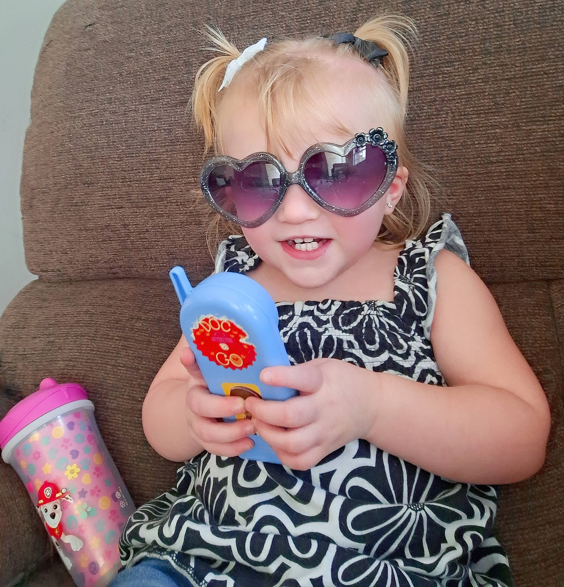 Everly joined the competition — help win amazing prizes! baby, baby_toddler_clothing, child, dress, eyewear, fun, glasses, goggles, happy, joy, lip, magenta, nail, person, pink, purple, sitting, summer, sunglasses, tableware