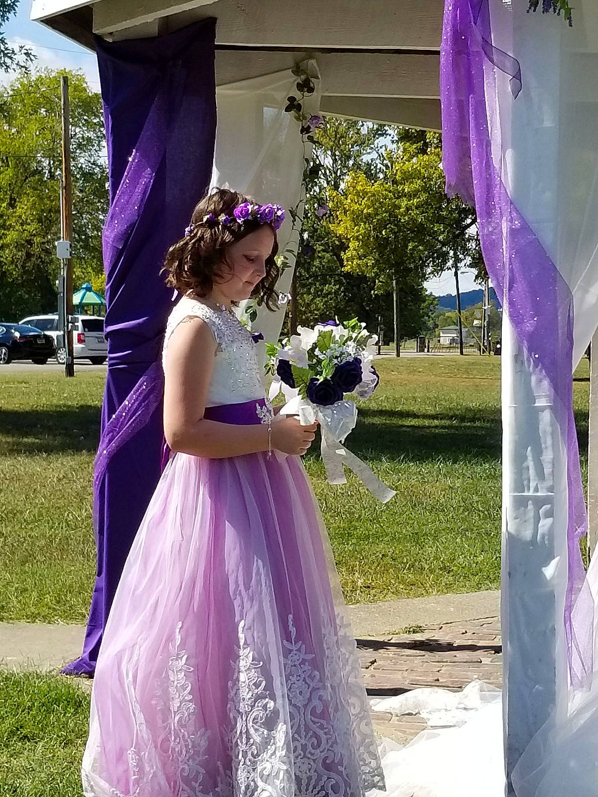 Kaylynn is registered to the contest to win money with this photo: aqua, botany, bridal_clothing, bridal_party_dress, bride, dress, flower, flower_arranging, gown, happy, person, petal, pink, plant, purple, textile, tree, violet, wedding_ceremony_supply, wedding_dress