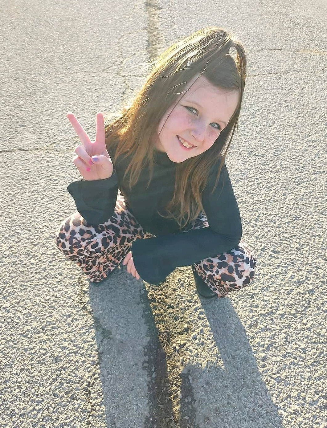 Kaylynn joined the competition — help win amazing prizes! arm, asphalt, finger, flash_photography, fun, gesture, grass, hair, hairstyle, hand, happy, human_body, joy, knee, mammal, people_in_nature, person, public_space, road_surface, sleeve