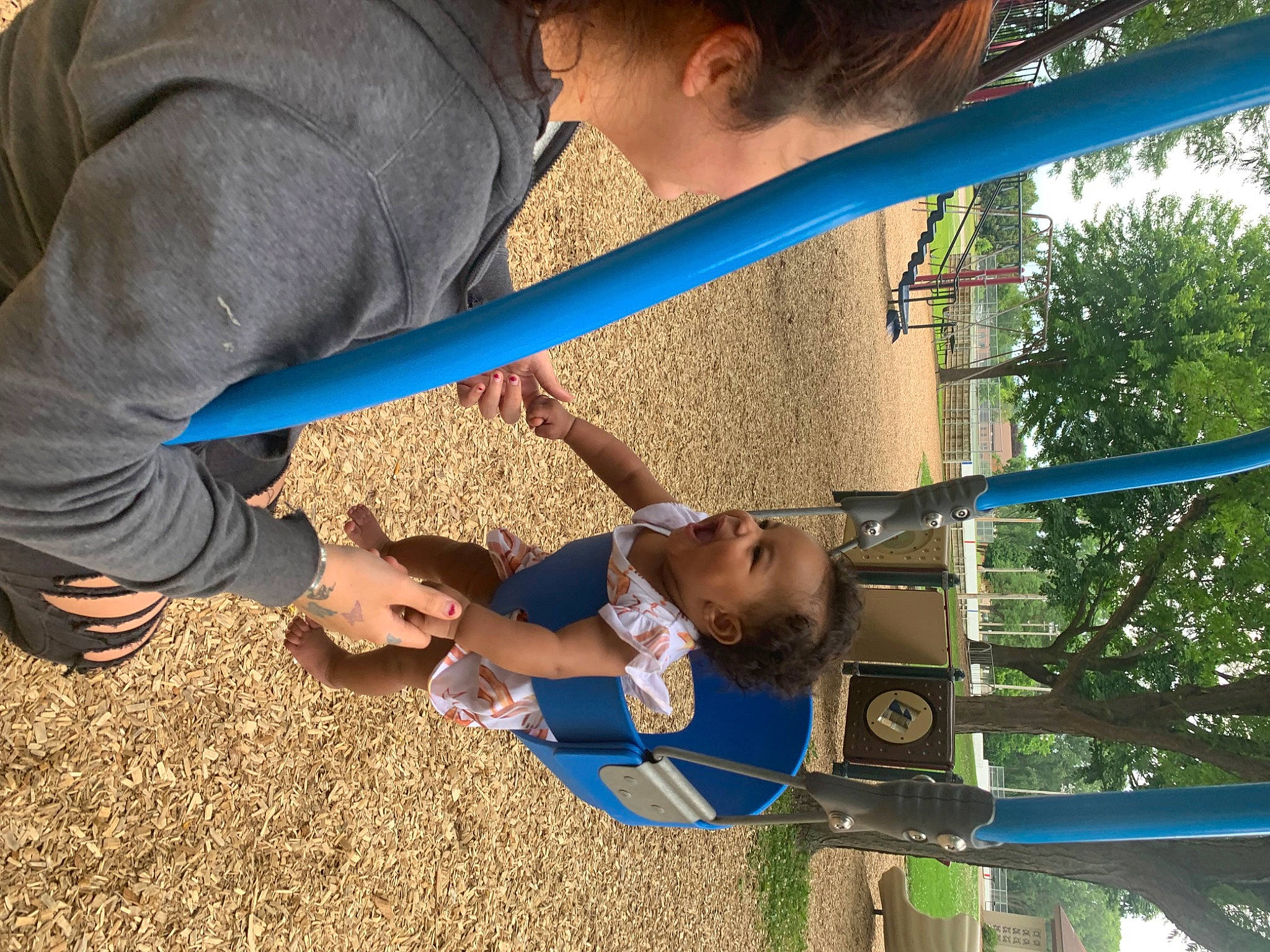 Azariah joined the competition — help win amazing prizes! child, city, elbow, fun, grass, happy, human_leg, human_settlement, leisure, outdoor_play_equipment, people_in_nature, person, play, playground, pole, recreation, soil, swing, t_shirt, toddler