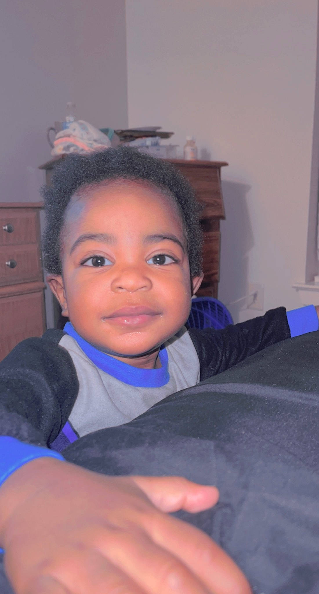 Jayceon is registered to the contest to win money with this photo: black_hair, cabinetry, chair, cheek, child, chin, comfort, drawer, ear, eyebrow, eyelash, forehead, fun, gesture, happy, nose, person, sitting, skin, smile