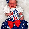 baby, blue_skirt, bow, celebration, clothing, cute, dress, fourth_of_july, headband, infant, newborn, patriotic, peaceful, portrait, red_bow, sleeping, small_hands, soft_texture, stars, white_background