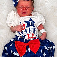 Sophia Grace is registered to the contest to win money with this photo: newborn, baby, sleeping, headband, bow, red_white_blue, stars, skirt, clothing, infant, cute, fluffy_background, portrait, celebration, holiday, fourth_of_july, lying_down, peaceful, small_hands, white_blanket