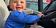 Esteban a rejoint le concours — aidez-le/la à gagner de superbes lots ! baby, car, clothing, coat, cushion, face, footwear, head, homedecor, hosiery, jeans, pants, person, photography, portrait, shoe, sitting, sock, transportation, vehicle