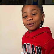 Brandon joined the competition — help win amazing prizes! casual_clothing, child, cute, expression, face, hair, happy, indoor, jordan, light_switch, person, playful, portrait, red_hoodie, room, smile, standing, wall, young, youth