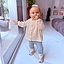 Victoire participe au concours pour gagner de l'argent avec cette photo : toddler, child, indoor, floor, glass_door, reflection, plant, jacket, jeans, sneakers, thumb_sucking, home_decor, window, light, person, smile, curly_hair, toy, modern, cute