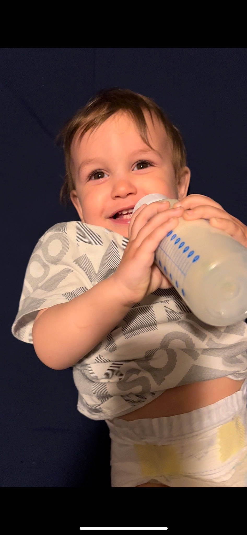 Hunter joined the competition — help win amazing prizes! arm, baby_bottle, bottle, cheek, drinkware, eyelash, finger, flash_photography, gesture, hand, happy, joint, joy, milk, nail, neck, nose, person, plastic_bottle, skin