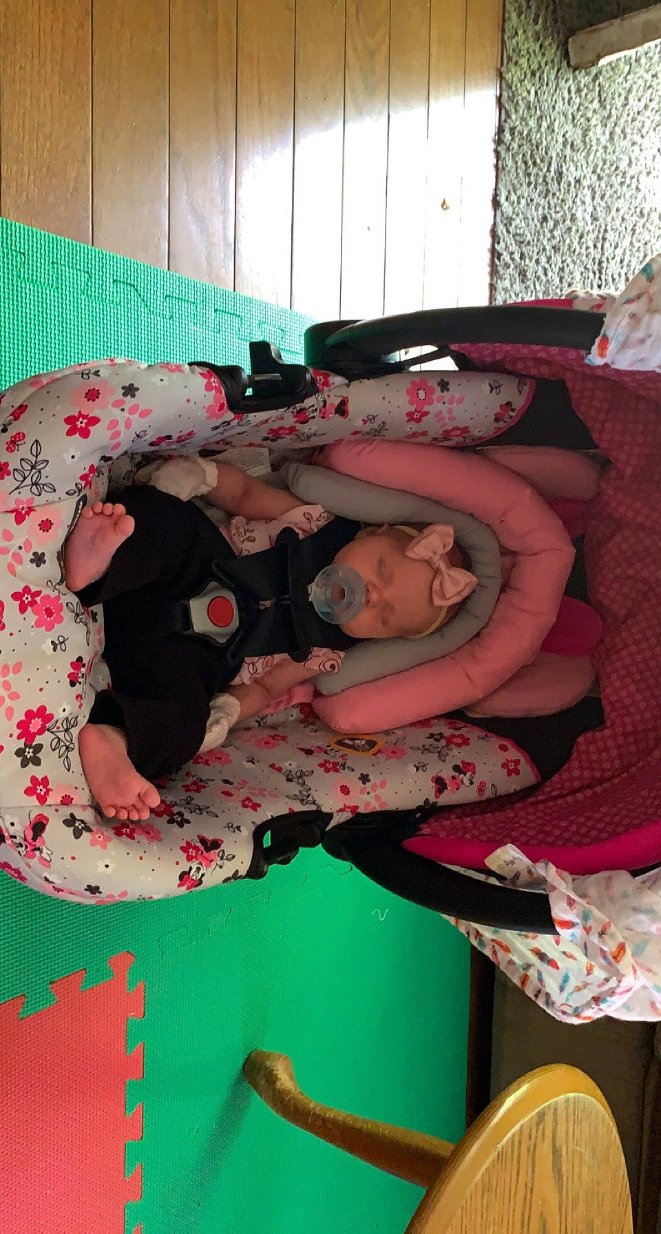 Evelyn is registered to the contest to win money with this photo: bed, bed_sheet, bedding, bedroom, carmine, child, comfort, flesh, flooring, headwear, linens, magenta, pattern, peach, person, pink, red, room, t_shirt, textile