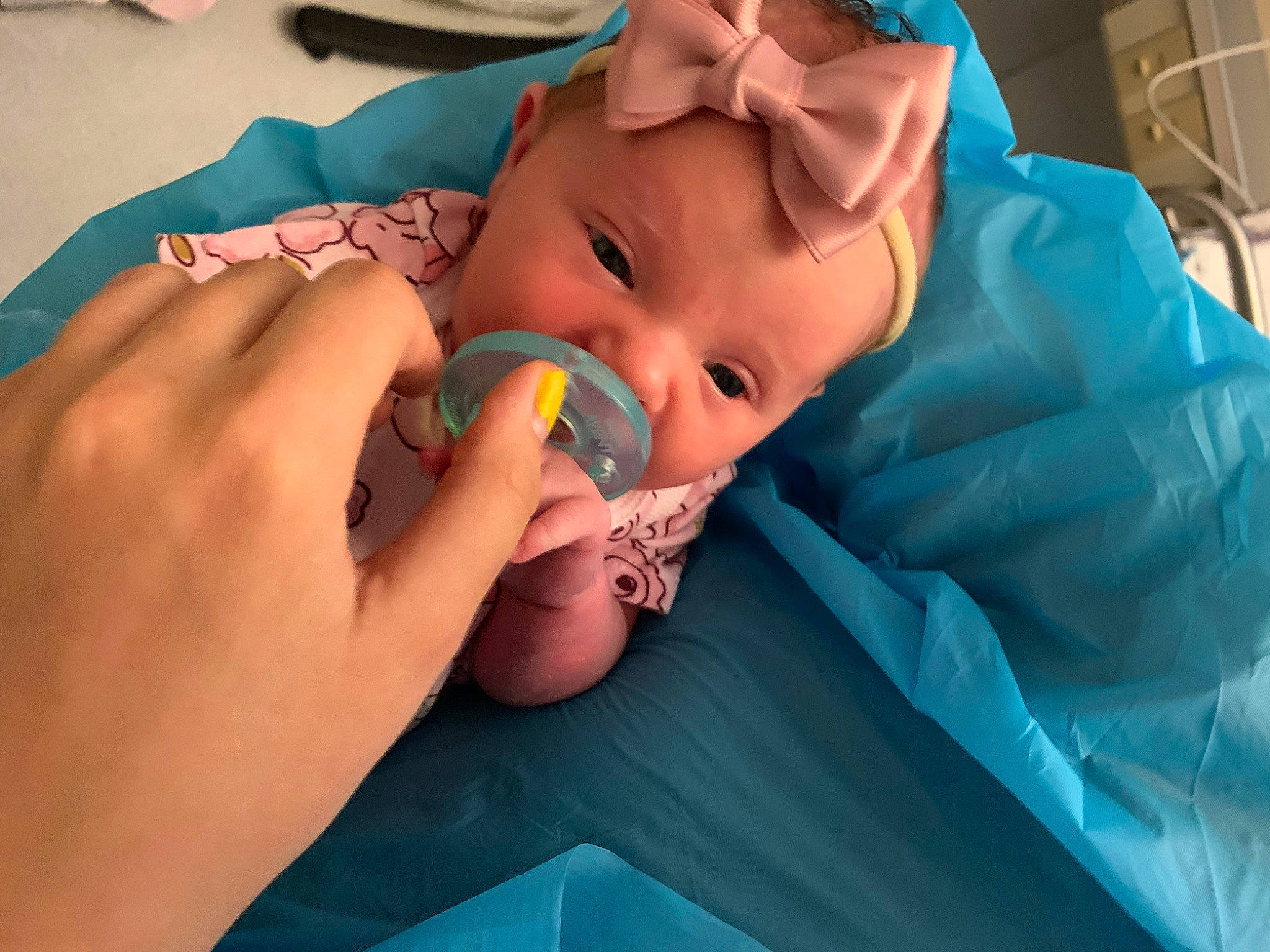 Evelyn is registered to the contest to win money with this photo: baby, baby_products, baby_toddler_clothing, blue, cheek, child, child_art, comfort, finger, fun, happy, iris, linens, mouth, nail, person, plastic, room, skin, thumb