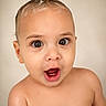 baby, child, face, expression, hair, mohawk, wet_hair, skin, portrait, cute, young, innocent, open_mouth, eyes, head, shoulders, closeup, surprised, studio, neutral_background