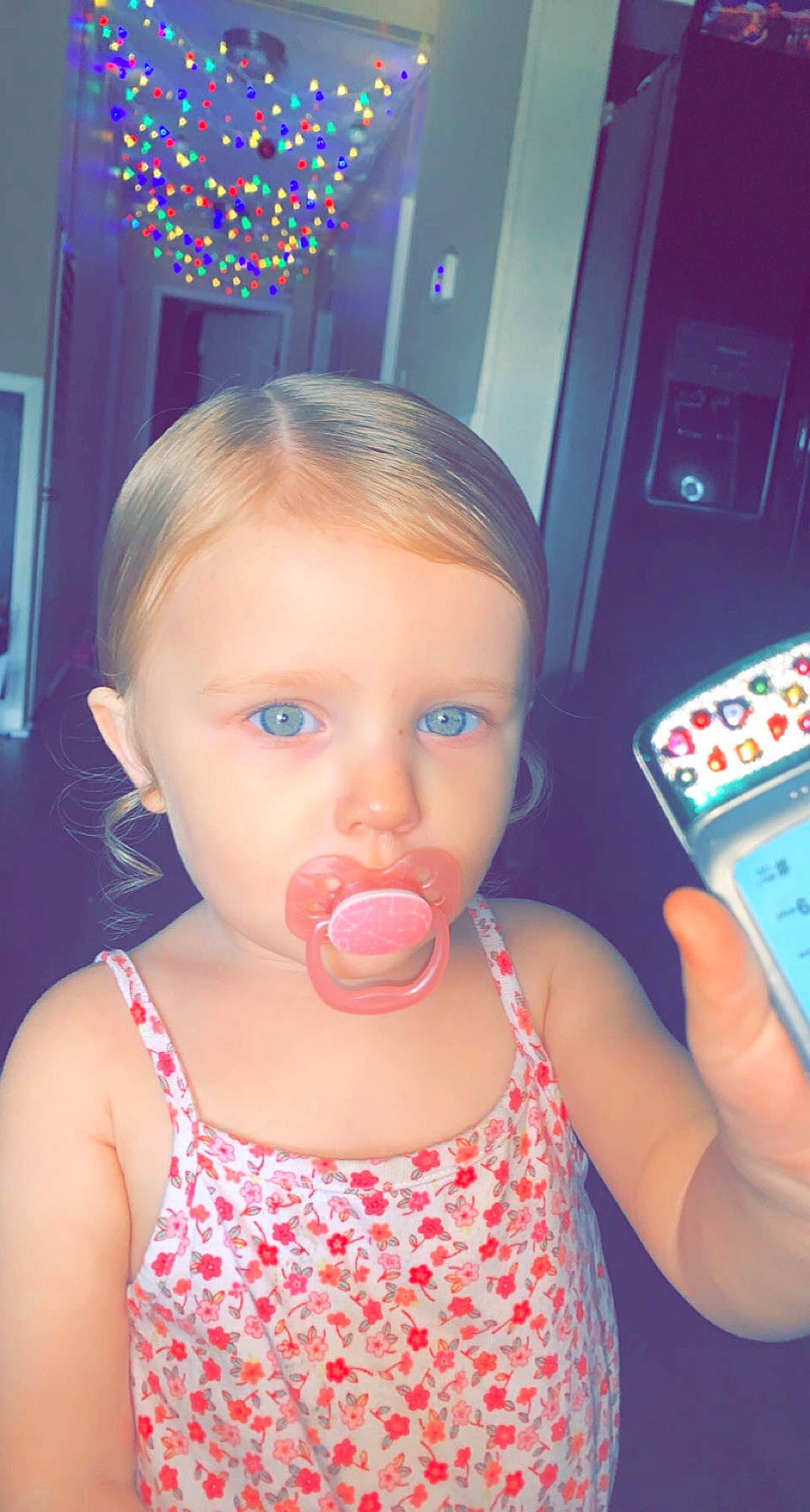 Bella is registered to the contest to win money with this photo: baby, baby_toddler_clothing, blue, cheek, child, drinking, drinkware, eyelash, finger, food, fun, gadget, happy, machine, nose, person, play, sweetness, tableware, toddler