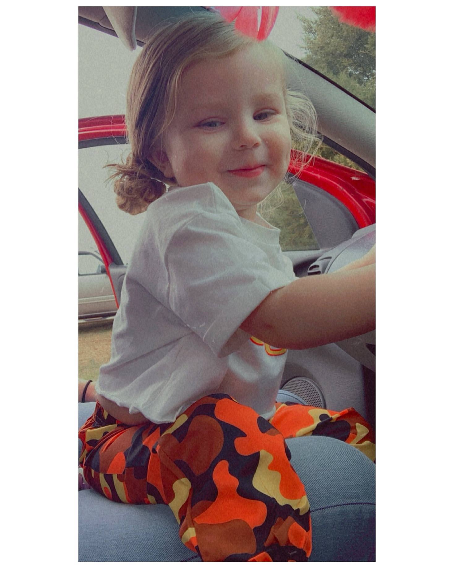 Bella is registered to the contest to win money with this photo: baby, baby_products, baby_toddler_clothing, beauty, car_seat, child, dress, face, hair, happy, head, joy, orange, pattern, person, product, sleeve, smile, t_shirt, toddler