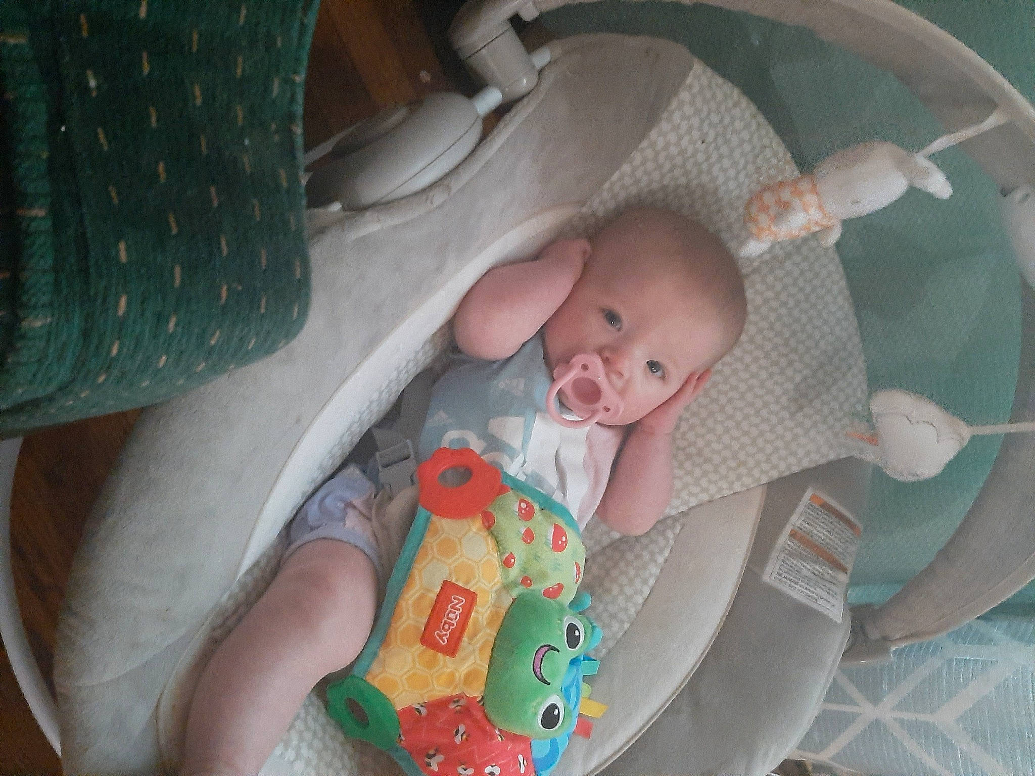 Genesis is registered to the contest to win money with this photo: baby, baby_products, baby_toddler_clothing, child, comfort, head, iris, linens, nail, pattern, person, product, room, sitting, skin, smile, toddler