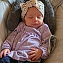 Olivia is registered to the contest to win money with this photo: baby, casual, child, clothing, comfort, cozy, cushion, footwear, hand, headband, home, indoor, infant, portrait, purple_clothing, relaxing, seat, sleeping, soft_lighting, young_child