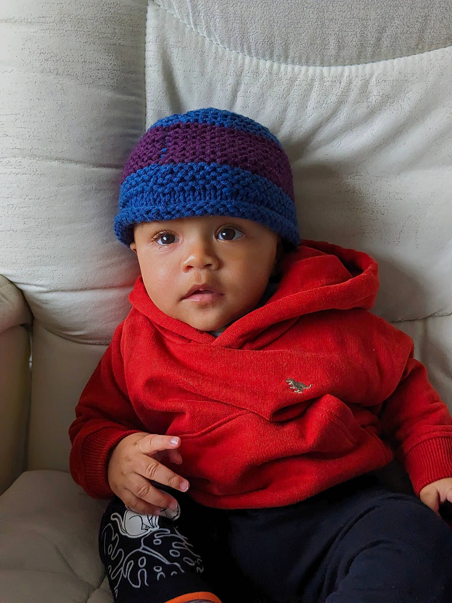 Dean joined the competition — help win amazing prizes! baby, baby_toddler_clothing, beanie, cap, cheek, child, comfort, electric_blue, fashion_accessory, headgear, headwear, knit_cap, outerwear, pattern, person, sitting, sleeve, textile, toddler, winter