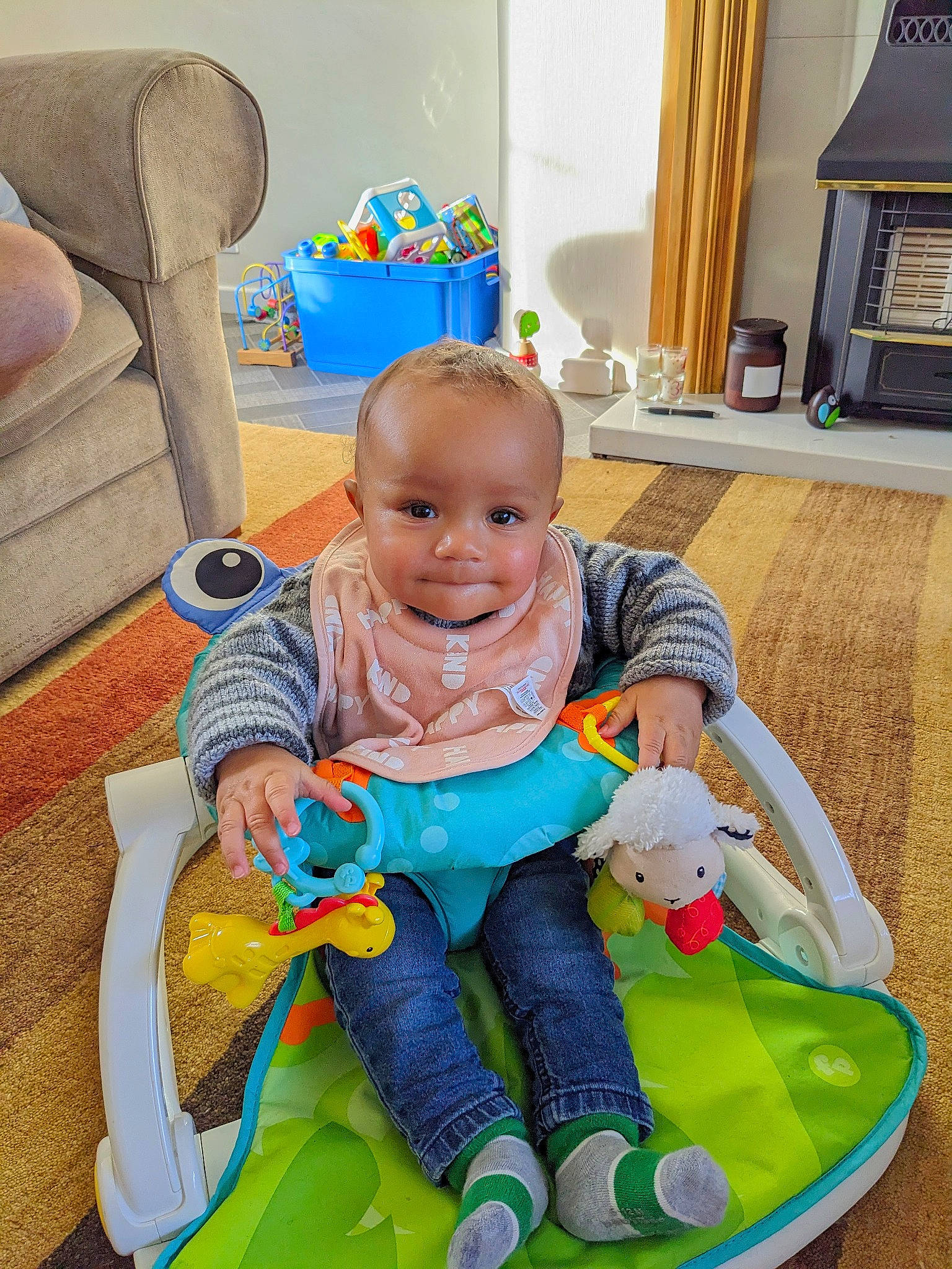 Dean joined the competition — help win amazing prizes! baby, baby_playing_with_toys, baby_products, baby_toddler_clothing, chair, cheek, child, comfort, flooring, fun, green, happy, lap, leisure, person, product, sitting, skin, smile, toddler