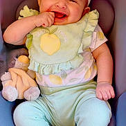 Kaeli is registered to the contest to win money with this photo: baby, infant, child, smiling, happy, portrait, car_seat, headband, flower, clothing, pastel, toy, stuffed_animal, finger, sitting, indoor, close_up, face, safe, photography