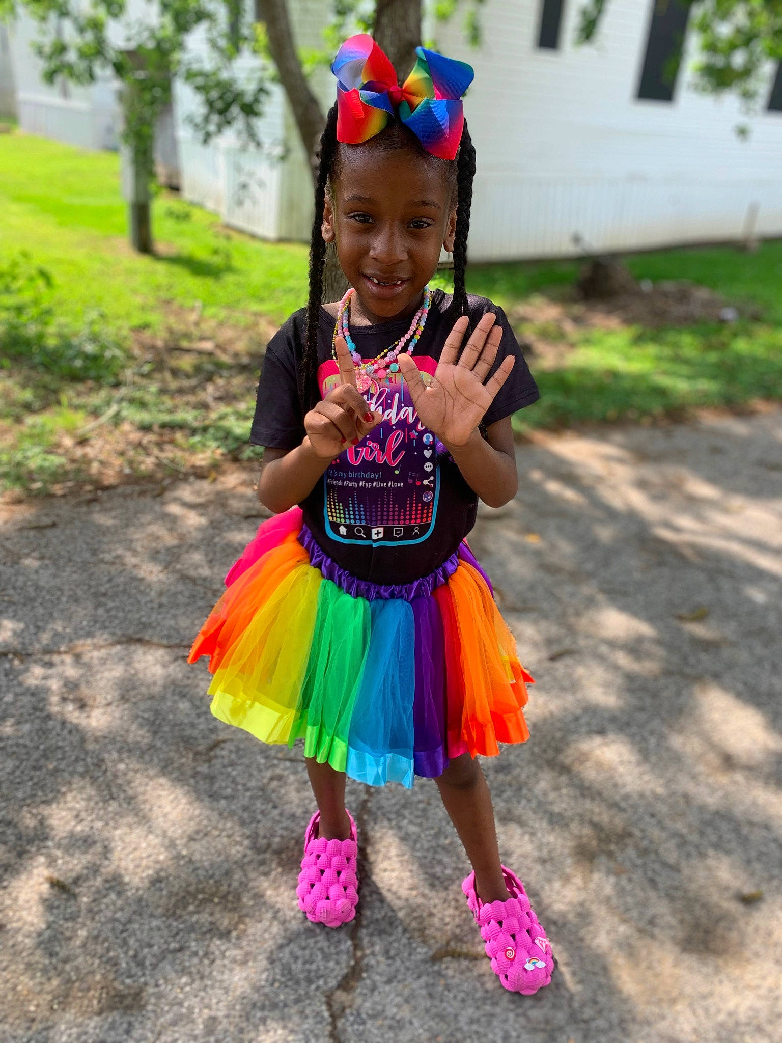 Iyanna is registered to the contest to win money with this photo: baby_toddler_clothing, child, costume, event, eye, face, fun, grass, happy, joy, leisure, magenta, person, pink, plant, recreation, sandal, smile, summer, sunglasses