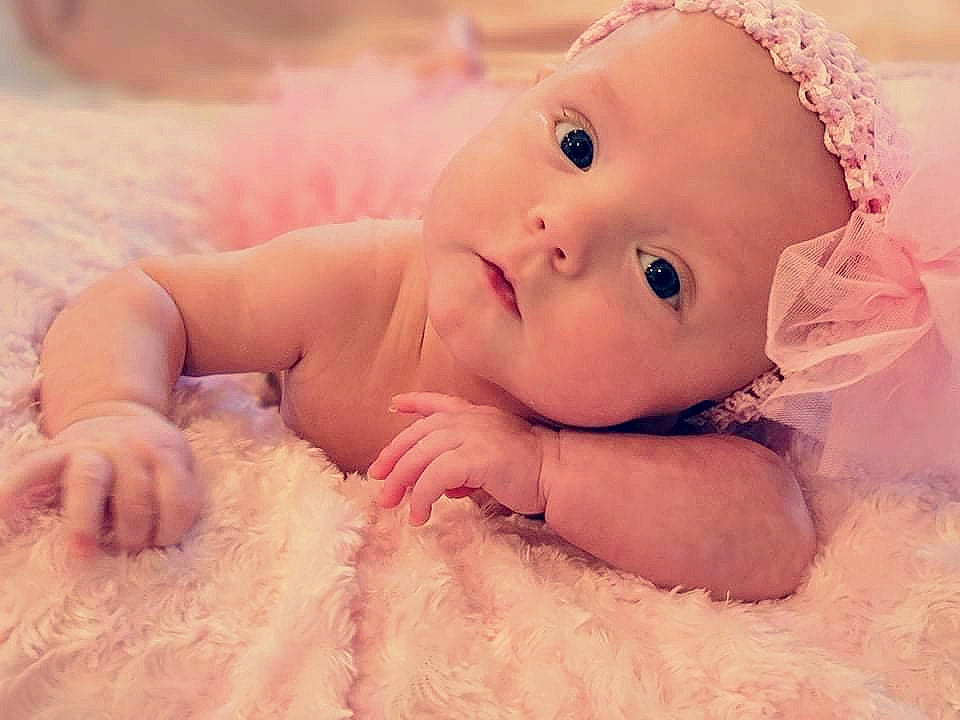 Emily is registered to the contest to win money with this photo: art, baby, baby_toddler_clothing, cap, cheek, close_up, fashion_accessory, fun, grass, hair_accessory, happy, linens, lip, nail, nose, people_in_nature, person, sitting, skin, toddler