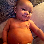 Kenlee is registered to the contest to win money with this photo: baby, infant, diaper, skin, smile, face, arm, torso, cute, child, newborn, lying_down, soft_lighting, indoors, person, expression, chubby, head, happy, resting