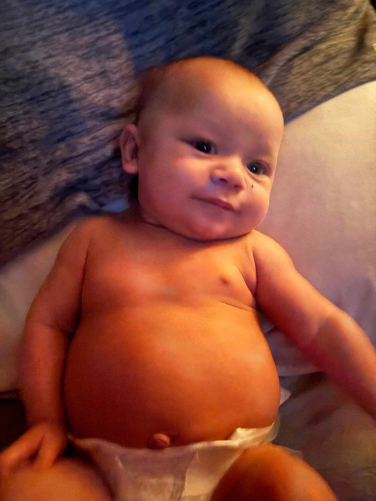 Kenlee is registered to the contest to win money with this photo: baby, infant, diaper, skin, smile, face, arm, torso, cute, child, newborn, lying_down, soft_lighting, indoors, person, expression, chubby, head, happy, resting