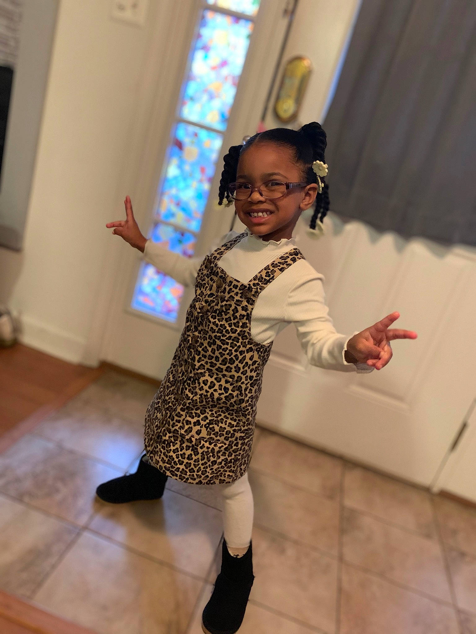 Kimberlee is registered to the contest to win money with this photo: child, entertainment, event, fashion_design, floor, flooring, fun, gesture, happy, human_leg, joy, leisure, pattern, performing_arts, person, room, shoe, sleeve, standing, toddler