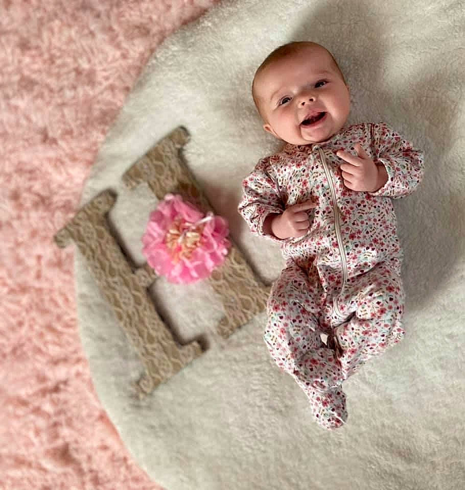 Harper joined the competition — help win amazing prizes! baby, baby_products, baby_sleeping, baby_toddler_clothing, clothing, face, fur, happy, head, human_body, leg, linens, nose, outerwear, person, pink, skin, sleeve, smile, textile