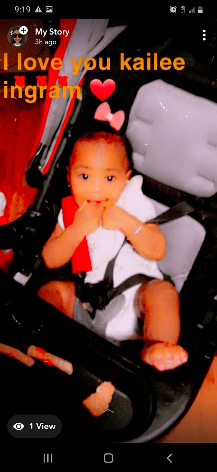 Kailee joined the competition — help win amazing prizes! action_figure, baby_carriage, baby_products, baby_toddler_clothing, baby_toys, car_seat, carmine, chair, child, doll, fictional_character, lap, person, pink, plastic, sitting, steering_wheel, thigh, toy