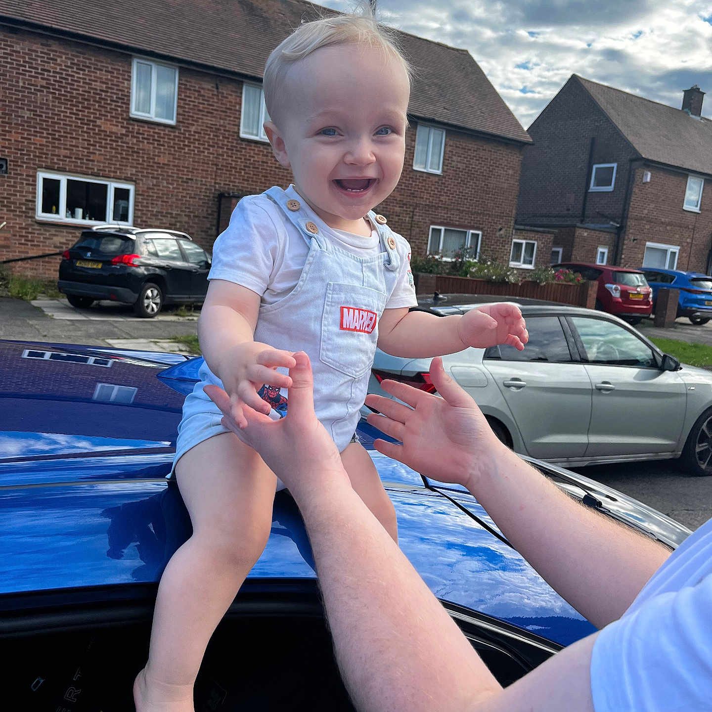 Hudson joined the competition — help win amazing prizes! architecture, building, car, city, coupe, face, head, neighborhood, outdoors, person, photography, portrait, road, sedan, shelter, sportscar, street, transportation, urban, vehicle