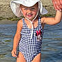 toddler, child, water, swimsuit, hat, sun_hat, holding_hand, beach, outdoor, summer, playground, sand, smiling, person, sunny, nature, trees, water_reflection, minnie_mouse, happy