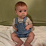 Koen joined the competition — help win amazing prizes! baby, child, infant, denim_overalls, striped_shirt, sitting, blanket, soft_texture, curious_expression, wide_eyes, indoors, portrait, cute, young_child, casual_clothing, barefoot, skin, head, face, person