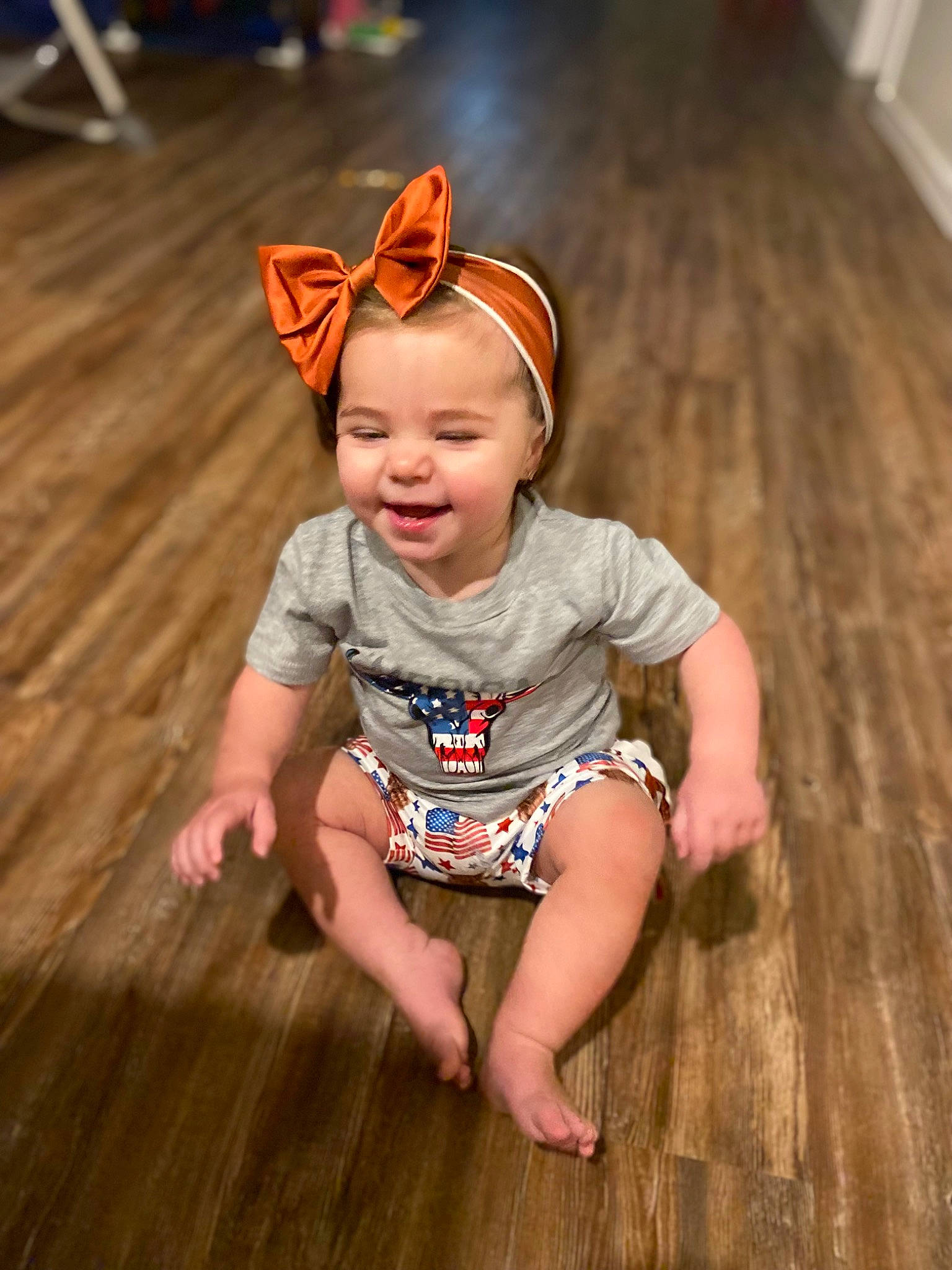 Lavender joined the competition — help win amazing prizes! baby, baby_toddler_clothing, cheek, child, costume_hat, eye, fashion_accessory, flooring, fun, grass, happy, hardwood, human_leg, person, sitting, skin, smile, toddler, wood, wood_flooring