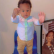 Joshua is registered to the contest to win money with this photo: accessories, adult, boy, child, clothing, doll, face, female, hair, head, jewelry, male, necklace, person, photography, portrait, shirt, sleeve, toy, woman