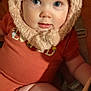 Ellianah is registered to the contest to win money with this photo: baby, child, face, hat, fluffy, blue_eyes, cute, infant, clothing, orange_outfit, sitting, portrait, indoor, warm, soft_texture, headwear, young_child, closeup, person, adorable