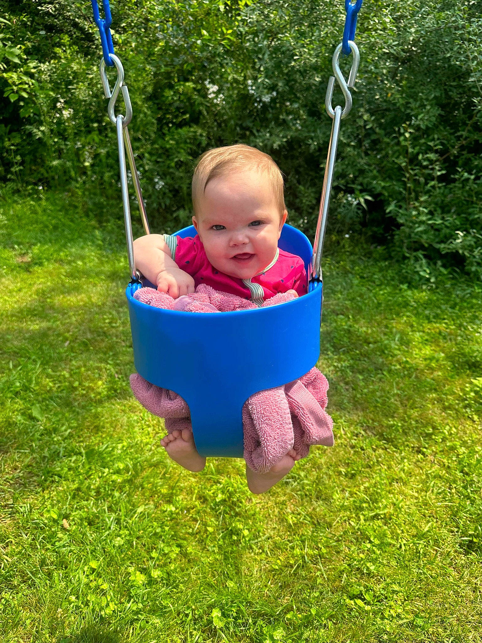 Gracelynn is registered to the contest to win money with this photo: baby, baby_toddler_clothing, blue, child, electric_blue, fun, grass, happy, lawn, leisure, outdoor_play_equipment, people_in_nature, person, plant, play, playground, recreation, smile, swing, toddler