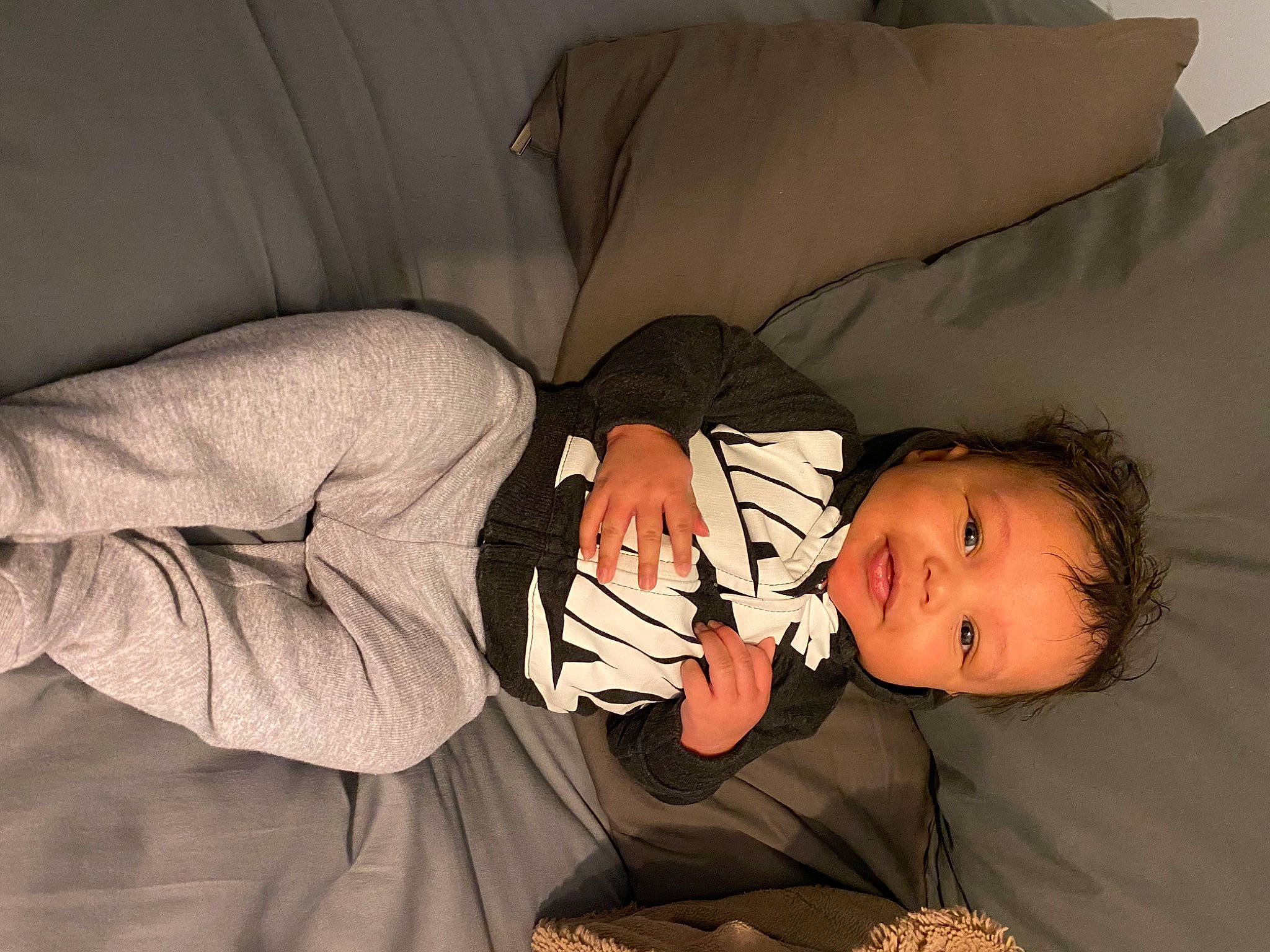 Ryder joined the competition — help win amazing prizes! baby, baby_toddler_clothing, cheek, child, comfort, couch, elbow, flash_photography, fun, happy, human_body, human_leg, lap, linens, nap, person, pillow, room, sitting, smile