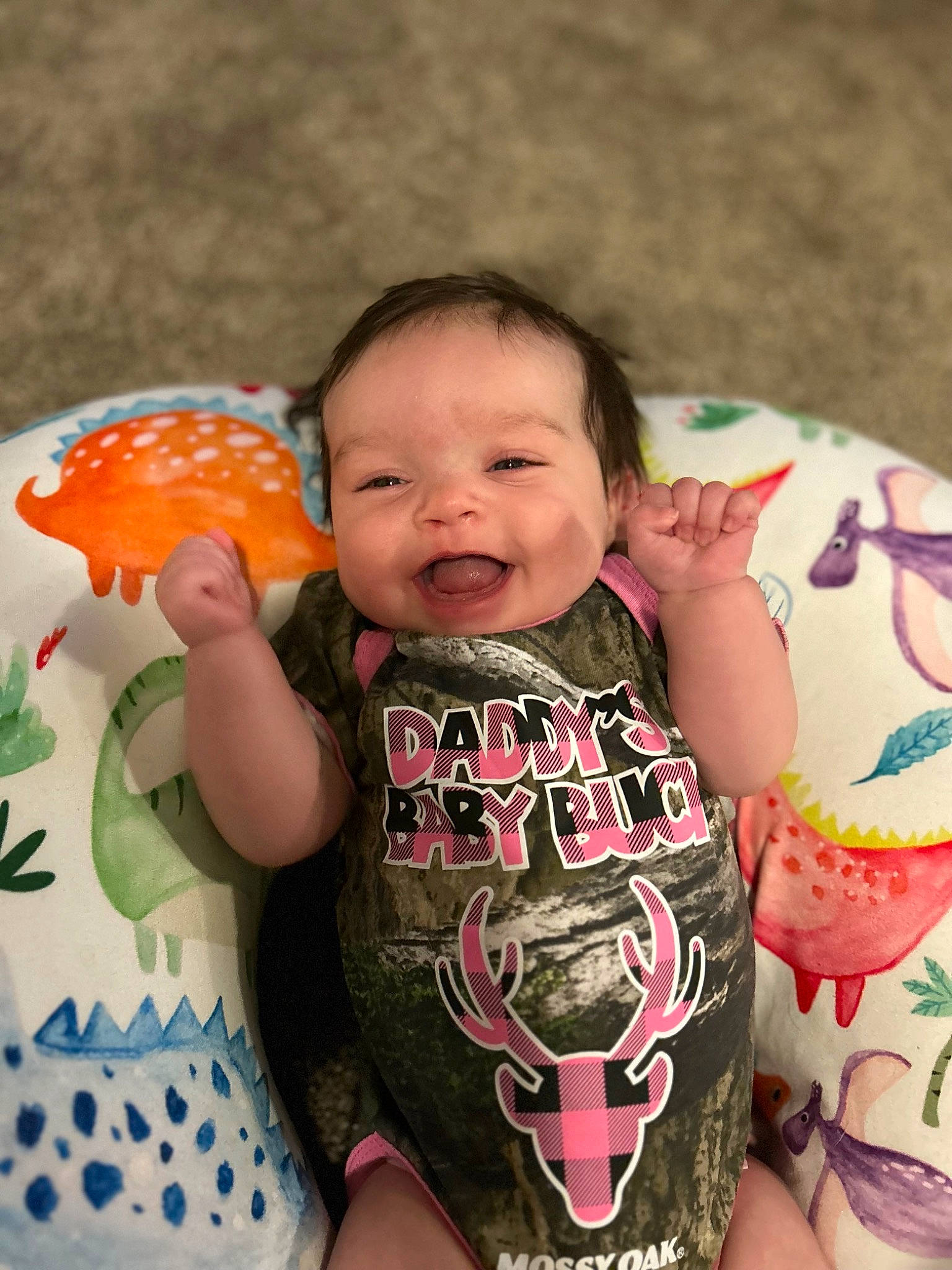 Saige is registered to the contest to win money with this photo: arm, baby, baby_toddler_clothing, cheek, child, eye, face, finger, hand, happy, iris, joy, lip, mouth, nose, organ, person, pink, skin, sleeve
